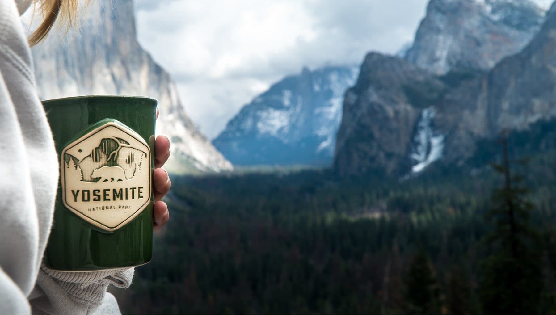 Custom Yosemite National Park mug held against the valley vista